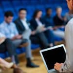 Facilitator leading an advanced PET-CT study day session, engaging healthcare professionals in collaborative learning and discussion.